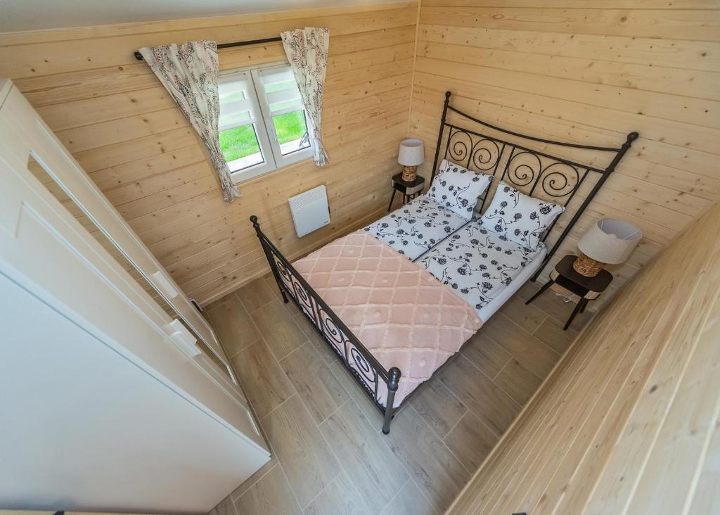 Posteľ alebo postele v izbe v ubytovaní Domek Romanówka