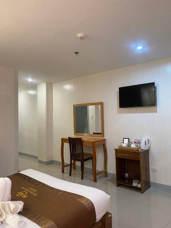 TV a/nebo společenská místnost v ubytování Belladama Hotel