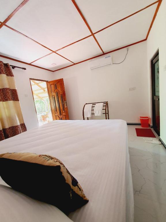 Postel nebo postele na pokoji v ubytování Jungle Eco Lodge & Safari