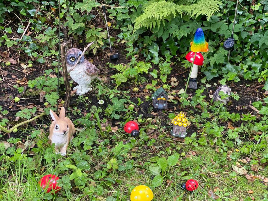 a group of toy animals sitting in the grass at Village Way Apartments in Kincasslagh