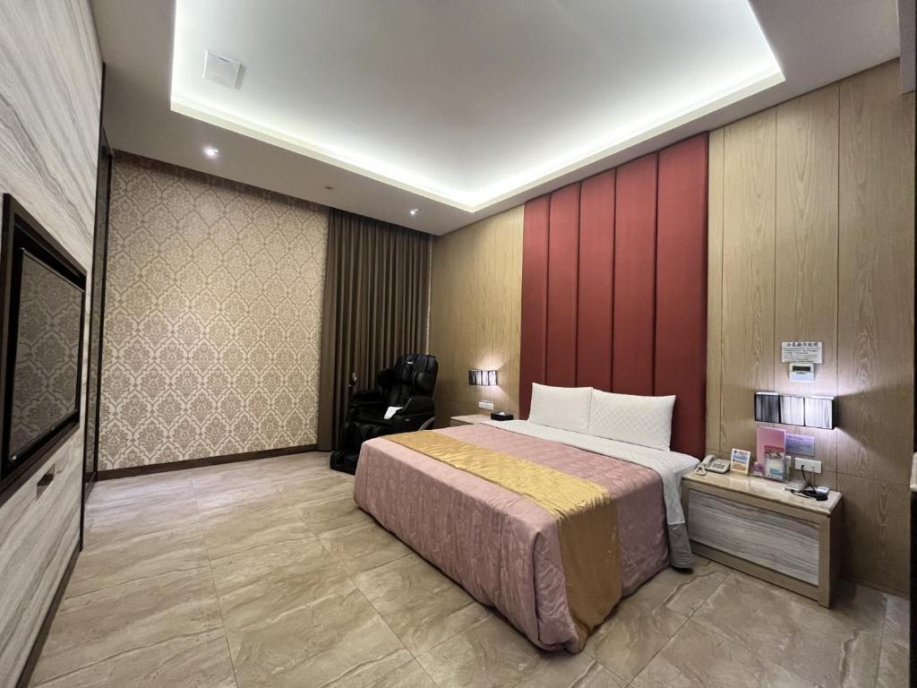 Postel nebo postele na pokoji v ubytování OUGE Boutique Motel - Pingtung