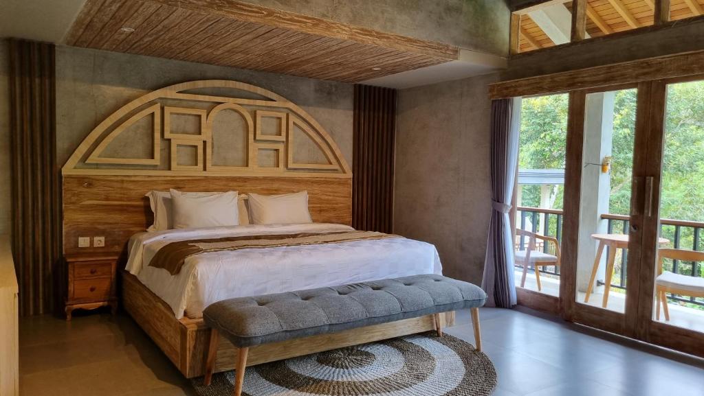 Postel nebo postele na pokoji v ubytování Gandatera Ubud