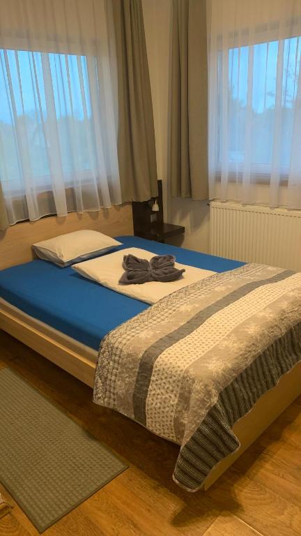 Postel nebo postele na pokoji v ubytování Toscan Panzió