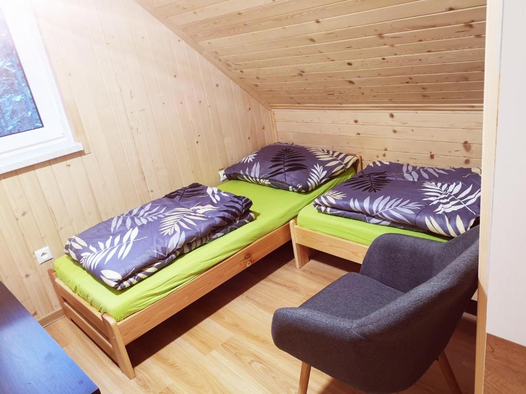 Postel nebo postele na pokoji v ubytování Chata Raztoka