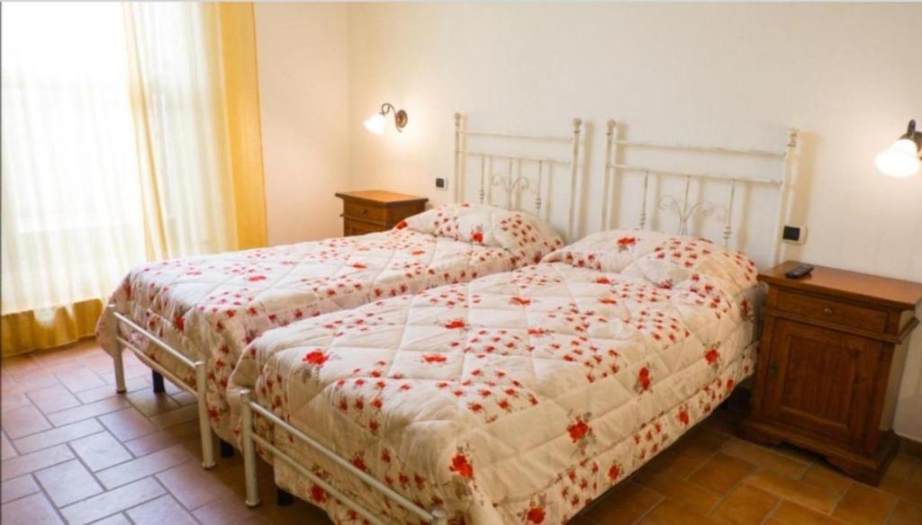 Postel nebo postele na pokoji v ubytování Affittacamere ALBA FIORITA