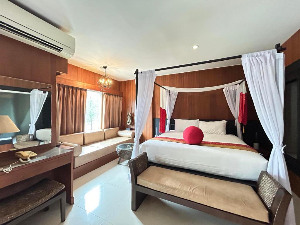 Postel nebo postele na pokoji v ubytování Benyada Lodge - Surin Beach