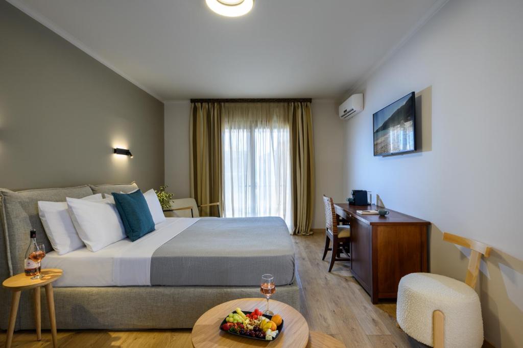 Postel nebo postele na pokoji v ubytování Elisso Hotel