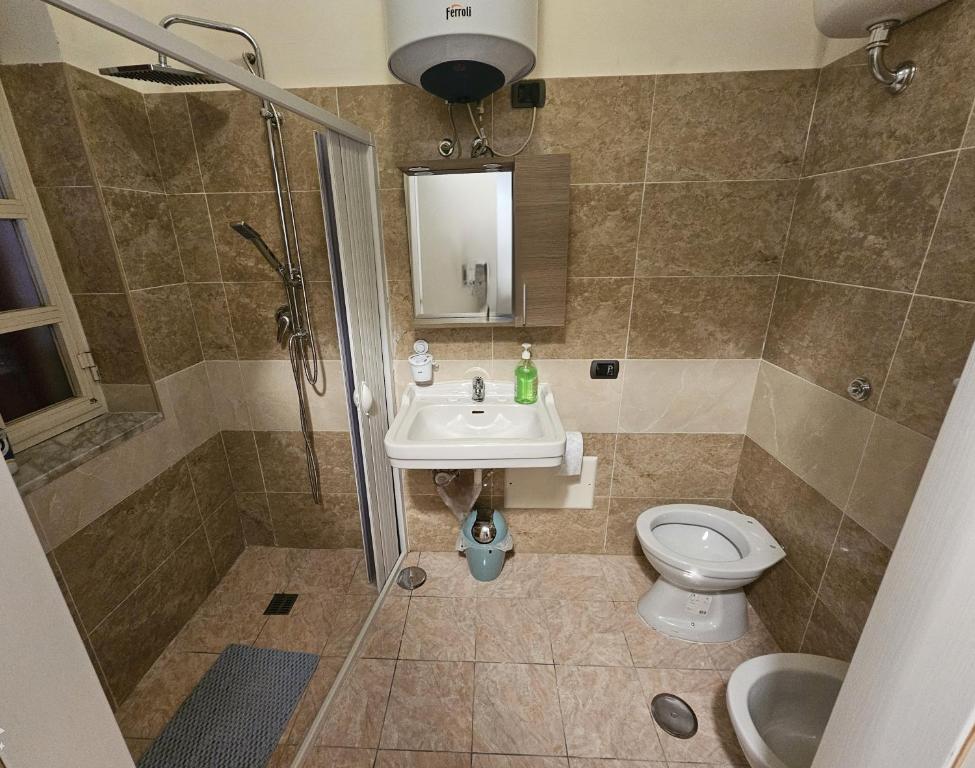Koupelna v ubytování GeMy Apartment