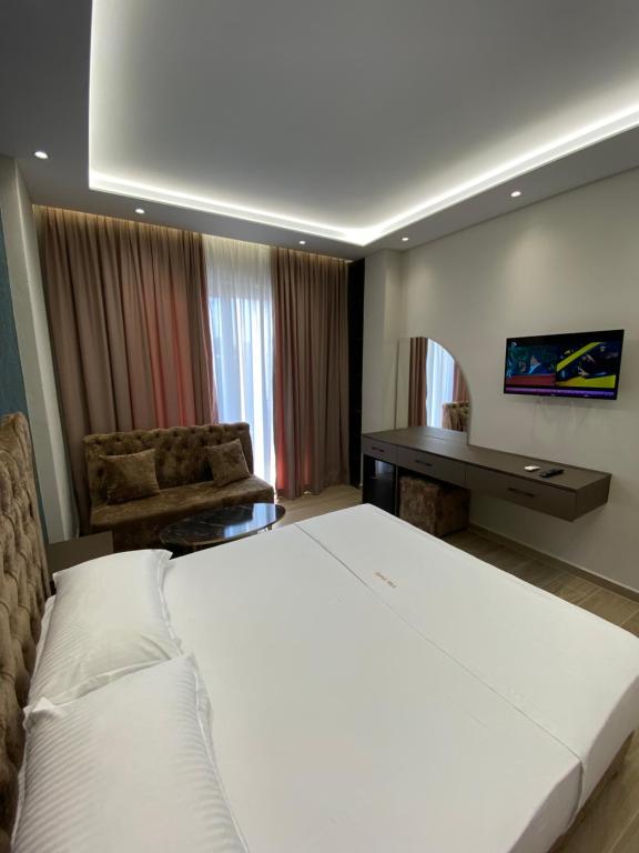 Postel nebo postele na pokoji v ubytování Hotel Vila Dedej