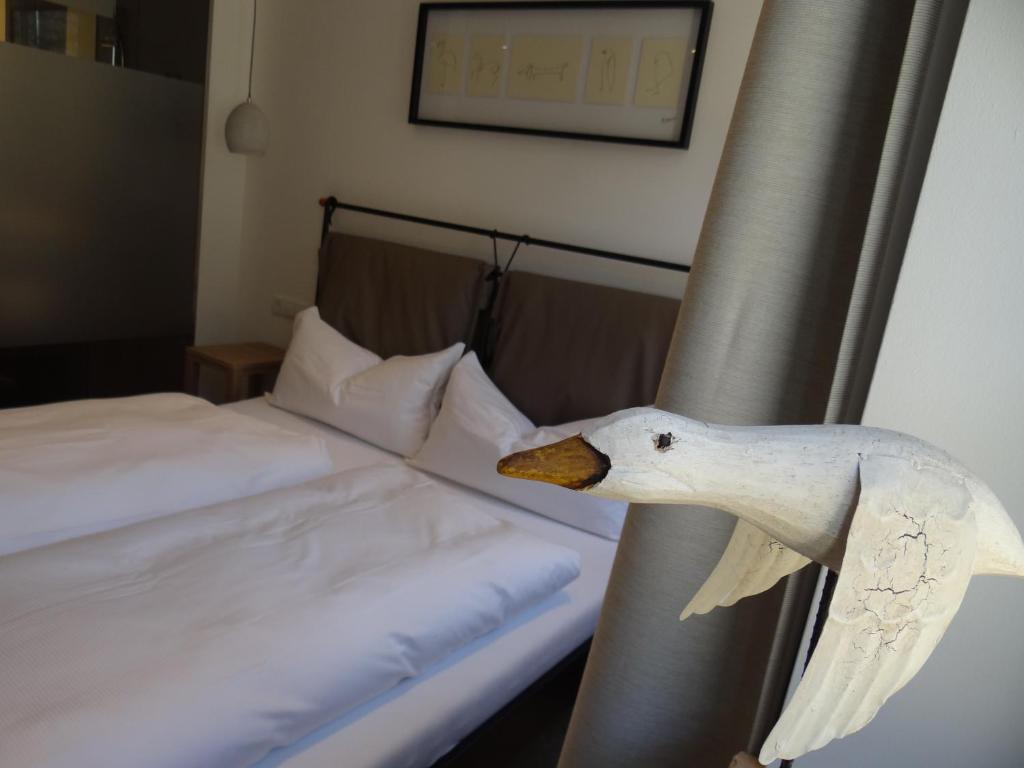 Postel nebo postele na pokoji v ubytování Bella Riva Hotel
