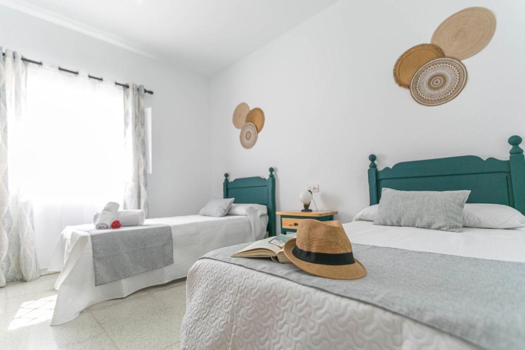 Postel nebo postele na pokoji v ubytování Embrujo Andaluz Complejo Rural Orgiva