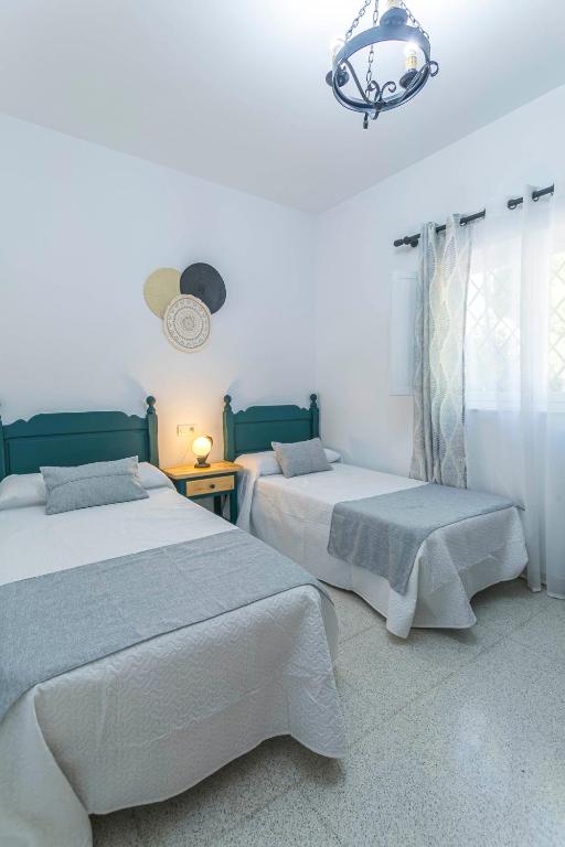 Postel nebo postele na pokoji v ubytování Embrujo Andaluz Complejo Rural Orgiva