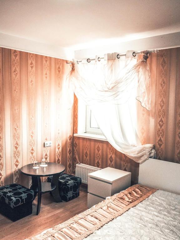 Postel nebo postele na pokoji v ubytování Tatjanos Dvaras