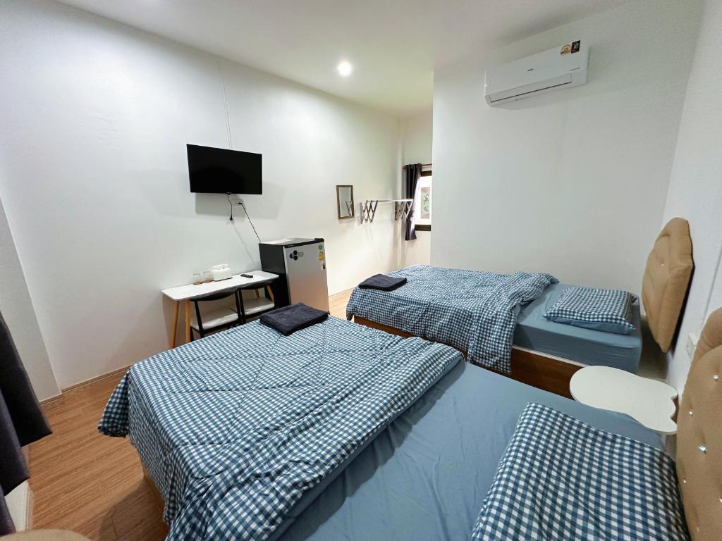 Voodi või voodid majutusasutuse Seamthong Resort เสียมทองรีสอร์ท toas