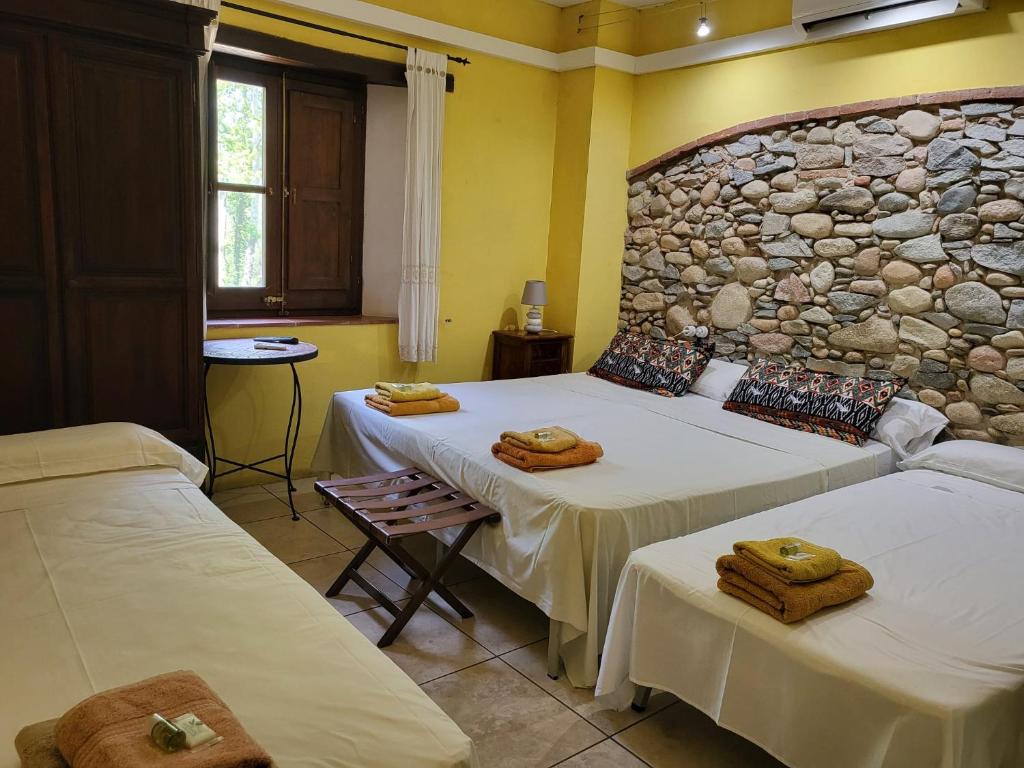 Postel nebo postele na pokoji v ubytování HOTEL PASTERAL RIU TER