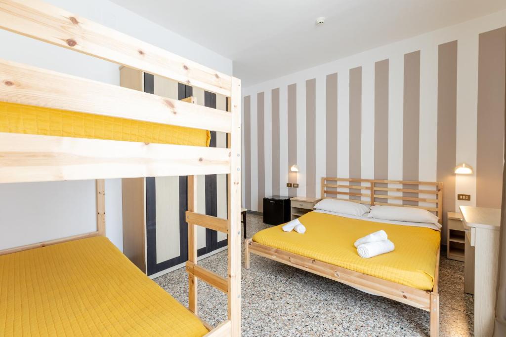 Postel nebo postele na pokoji v ubytování Beach Hotel Clerice