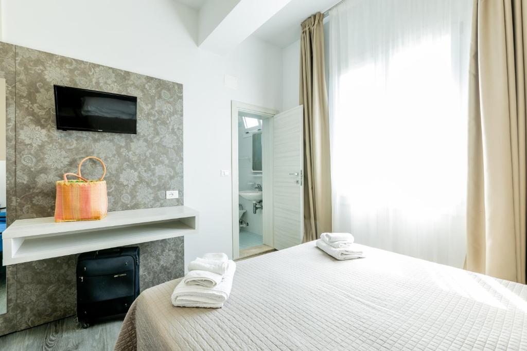 Postel nebo postele na pokoji v ubytování Hotel Kim