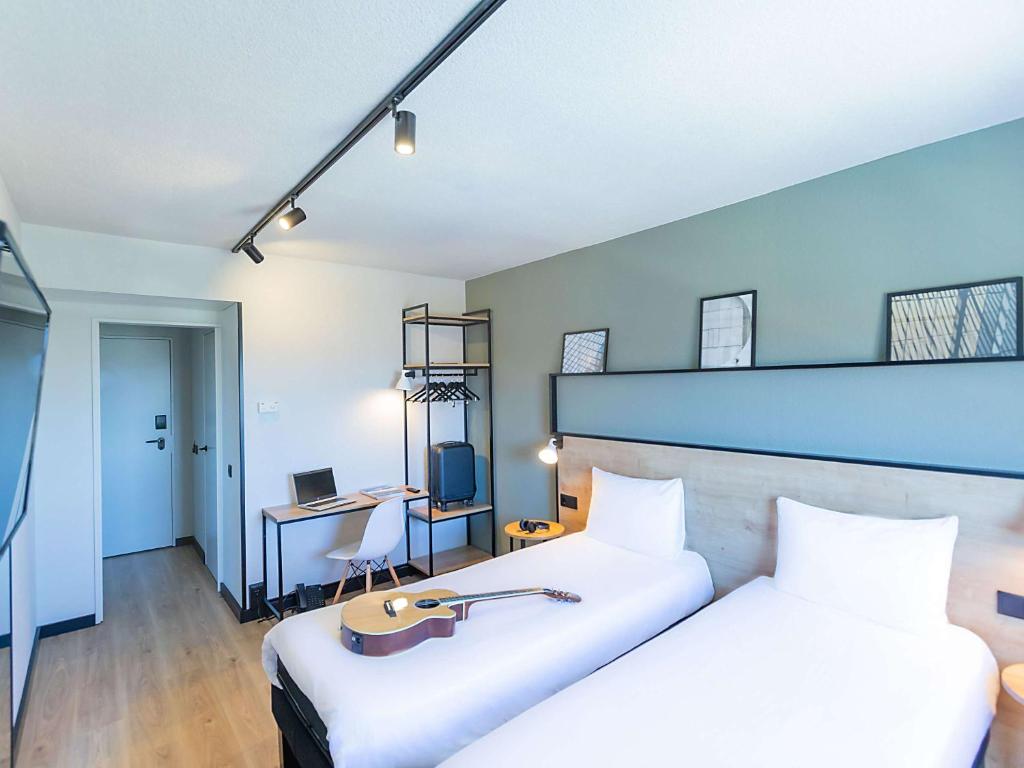 Postel nebo postele na pokoji v ubytování Hotel ibis Guimaraes