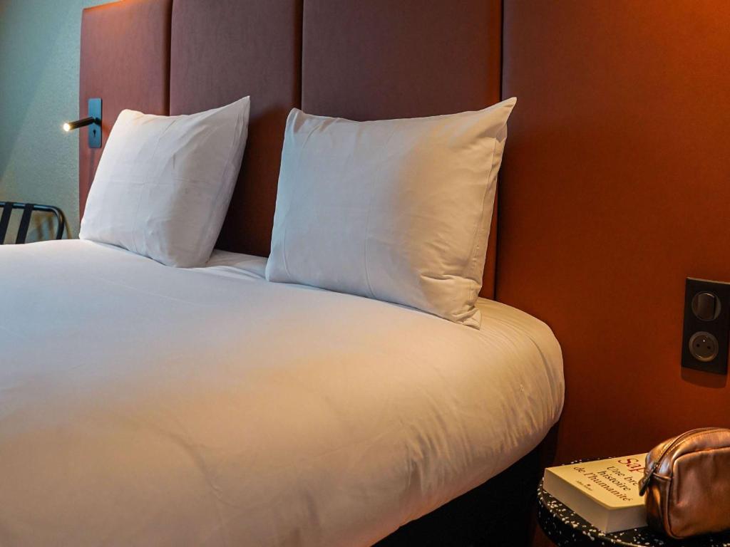 Кровать или кровати в номере ibis Bayeux Port En Bessin