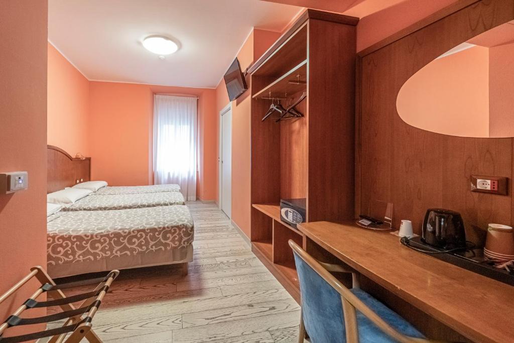 Posteľ alebo postele v izbe v ubytovaní Hotel Italia