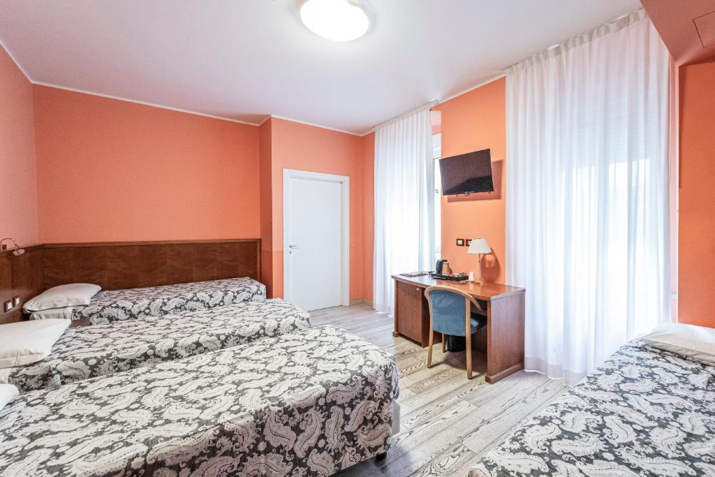 Posteľ alebo postele v izbe v ubytovaní Hotel Italia