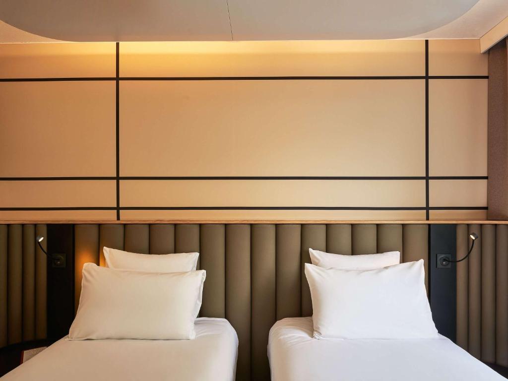 Postel nebo postele na pokoji v ubytování Mercure Paris Nanterre