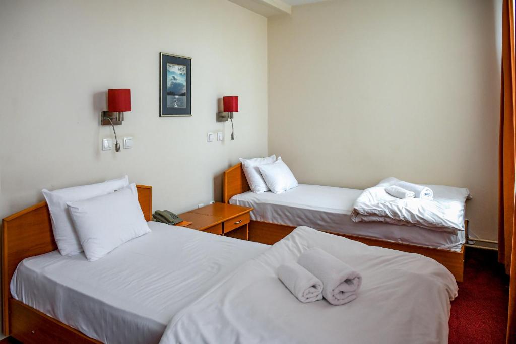 Postel nebo postele na pokoji v ubytování Hotel Fontana