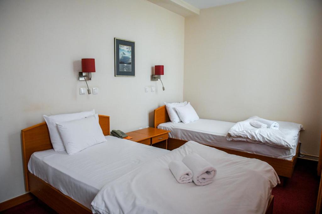 Postel nebo postele na pokoji v ubytování Hotel Fontana