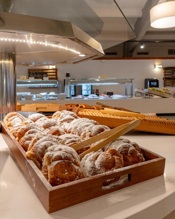 a box of pastries on a counter in a bakery at Ohtels Carabela in Matalascañas