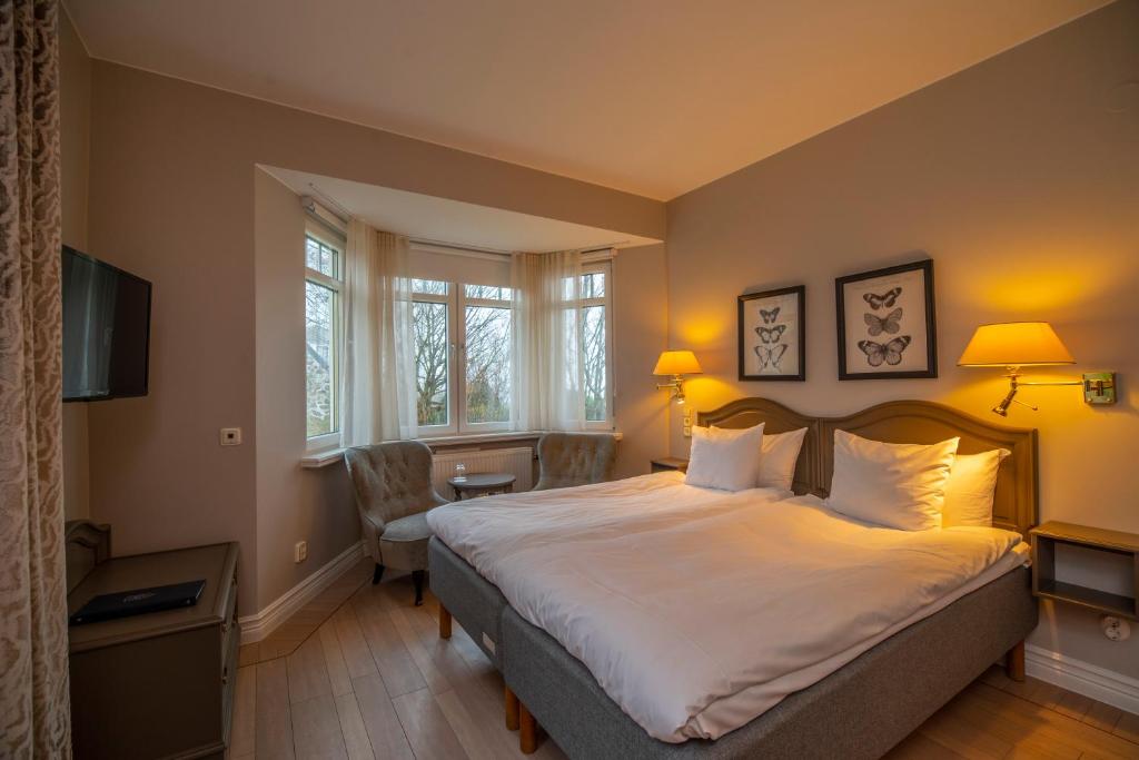 Postel nebo postele na pokoji v ubytování Hotel Rusthållargården