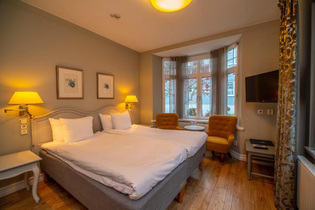 Postel nebo postele na pokoji v ubytování Hotel Rusthållargården