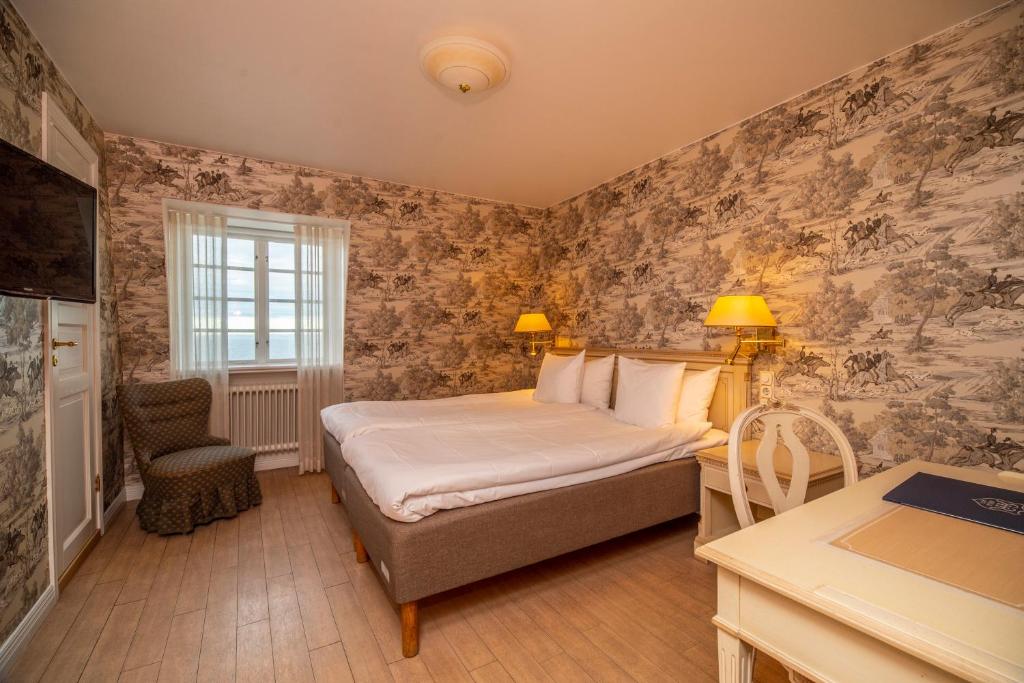 Postel nebo postele na pokoji v ubytování Hotel Rusthållargården