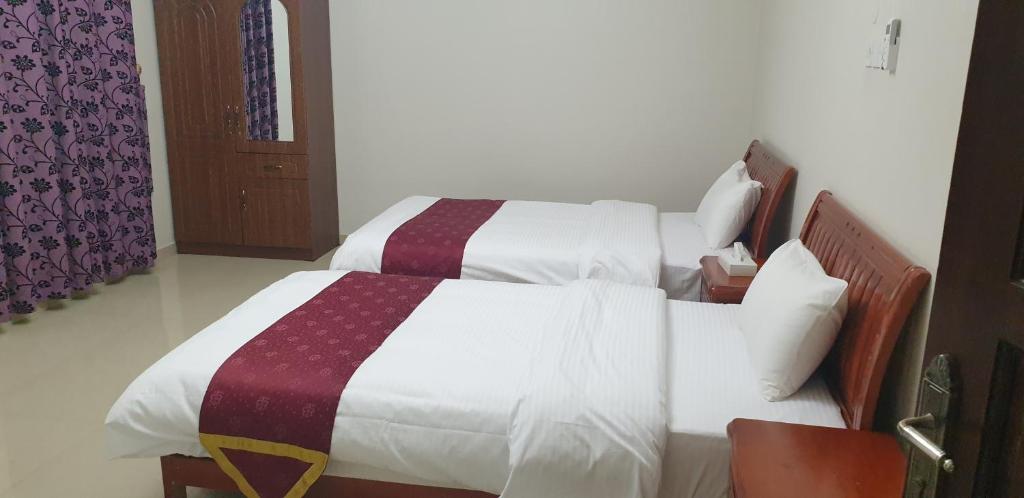 Postel nebo postele na pokoji v ubytování Bahla Hotel Apartments