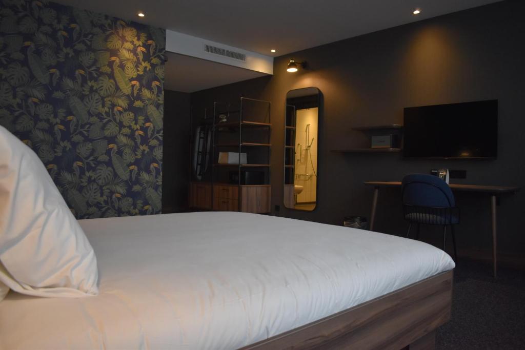 Postel nebo postele na pokoji v ubytování Van der Valk Hotel Eindhoven