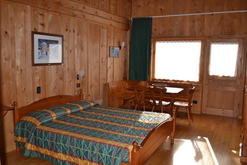 Postel nebo postele na pokoji v ubytování Albergo Rendola