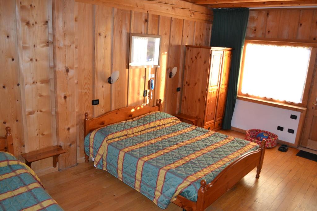 Postel nebo postele na pokoji v ubytování Albergo Rendola