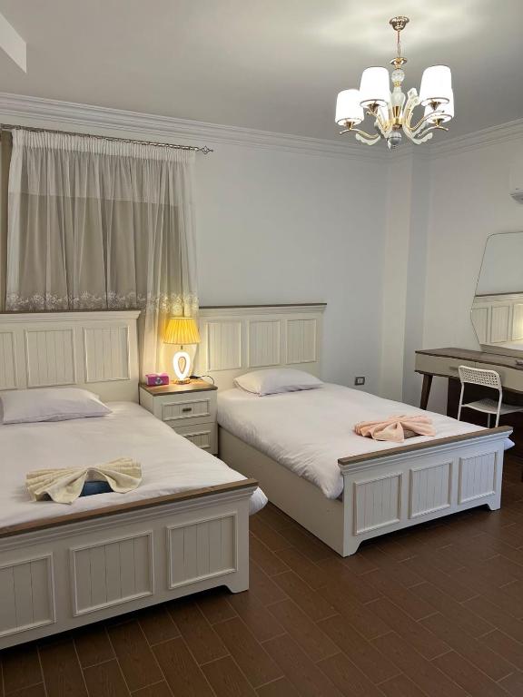Postel nebo postele na pokoji v ubytování oasis guest house