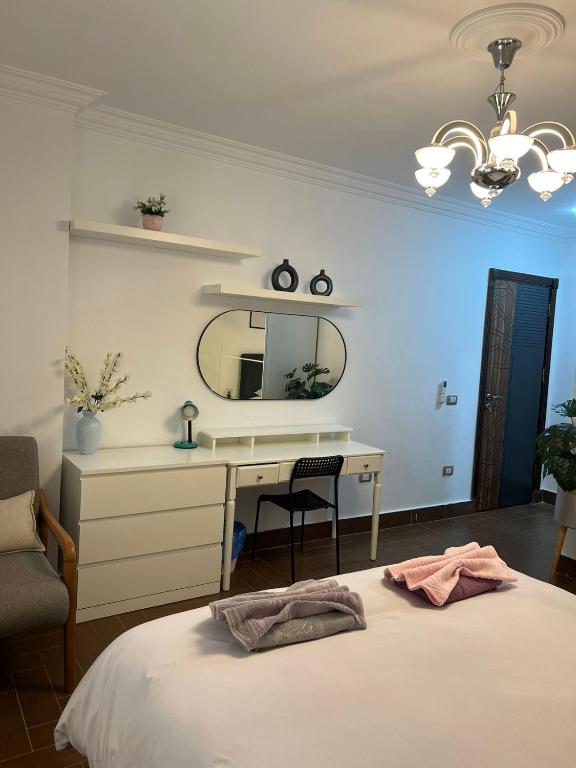 Postel nebo postele na pokoji v ubytování oasis guest house