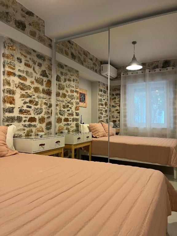 Postel nebo postele na pokoji v ubytování Maria's jasmine