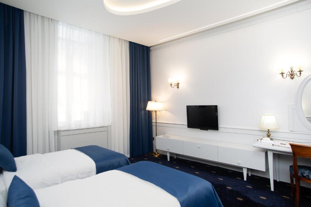 Una cama o camas en una habitación de Hotel Europe