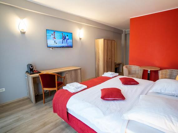 Postel nebo postele na pokoji v ubytování Hotel Perla