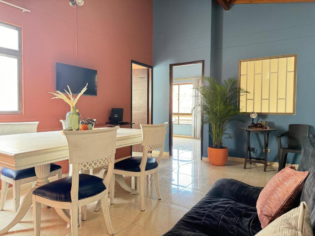 a dining room with a table and chairs at Apartamento Relax in Medellín
