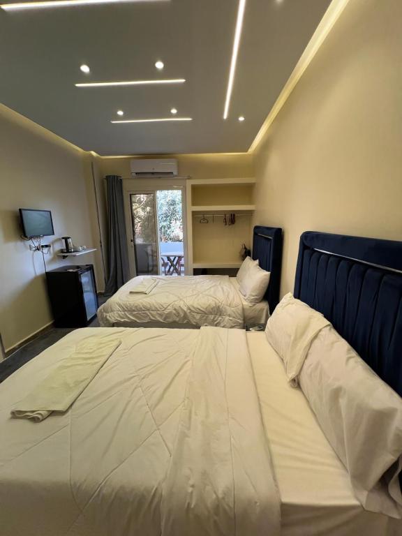Letto o letti in una camera di Moses Pyramids Inn