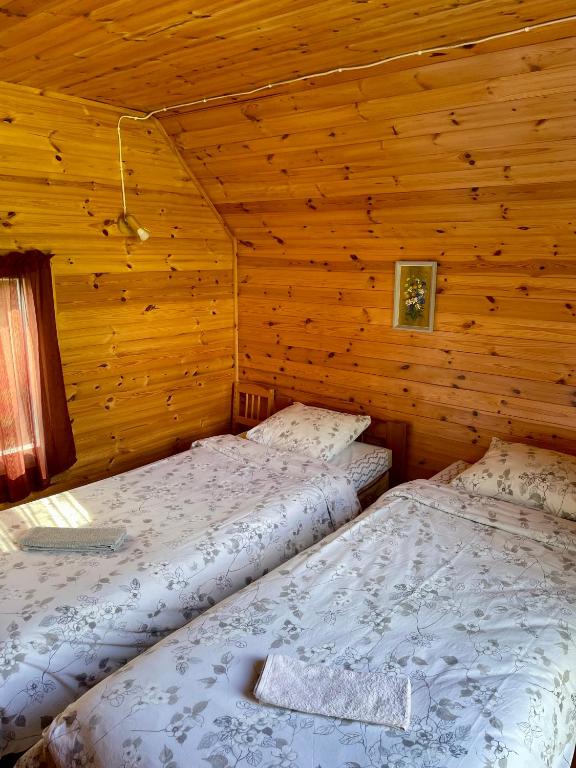 Postel nebo postele na pokoji v ubytování Little Garden House