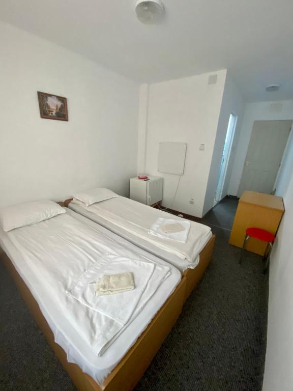 Postel nebo postele na pokoji v ubytování Vila Onix