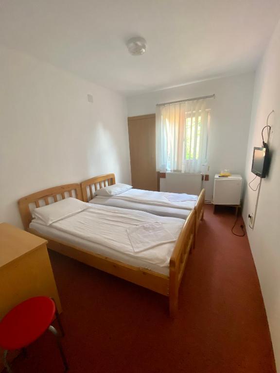 Postel nebo postele na pokoji v ubytování Vila Onix