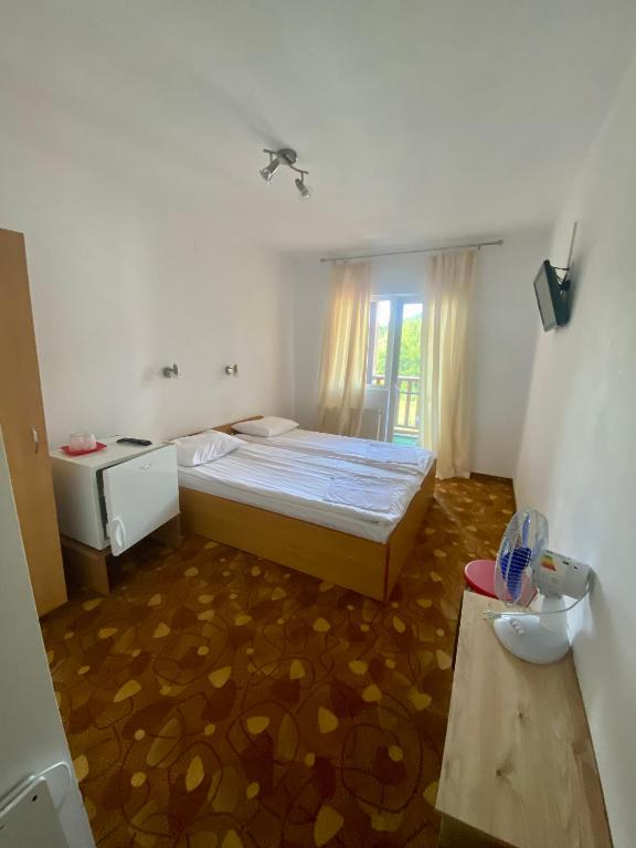 Postel nebo postele na pokoji v ubytování Vila Onix