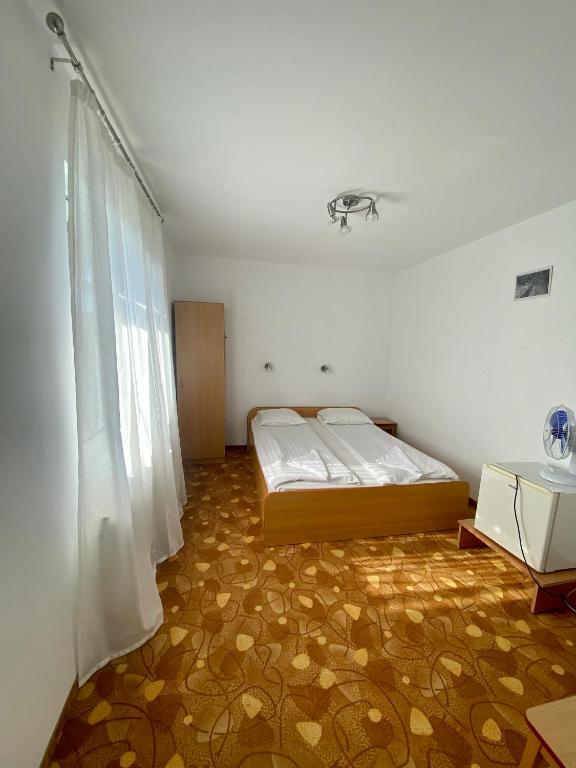 Postel nebo postele na pokoji v ubytování Vila Onix