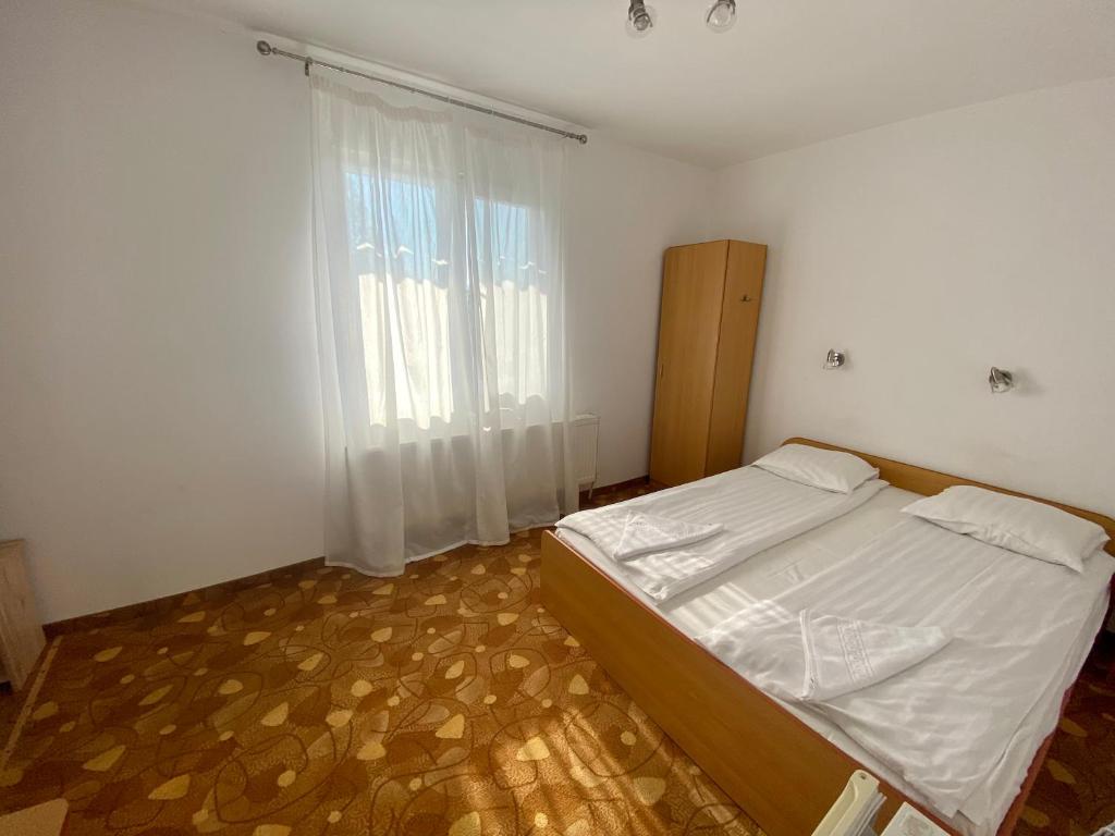 Postel nebo postele na pokoji v ubytování Vila Onix