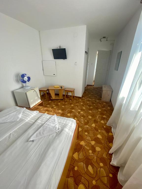 Postel nebo postele na pokoji v ubytování Vila Onix
